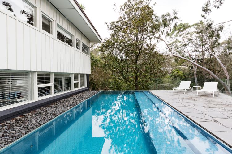 Beautiful swimming pool with bluestone pavers