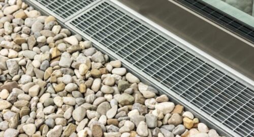 Drain surrounded by pebbles