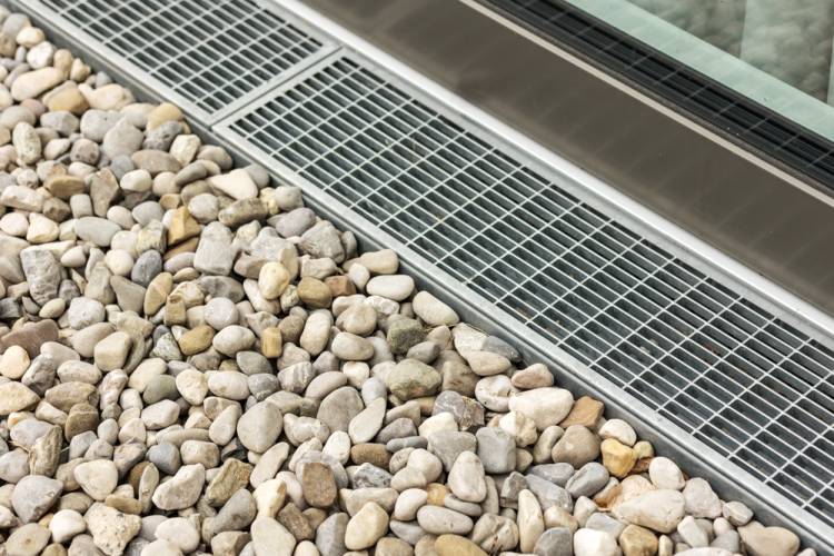 Drain surrounded by pebbles